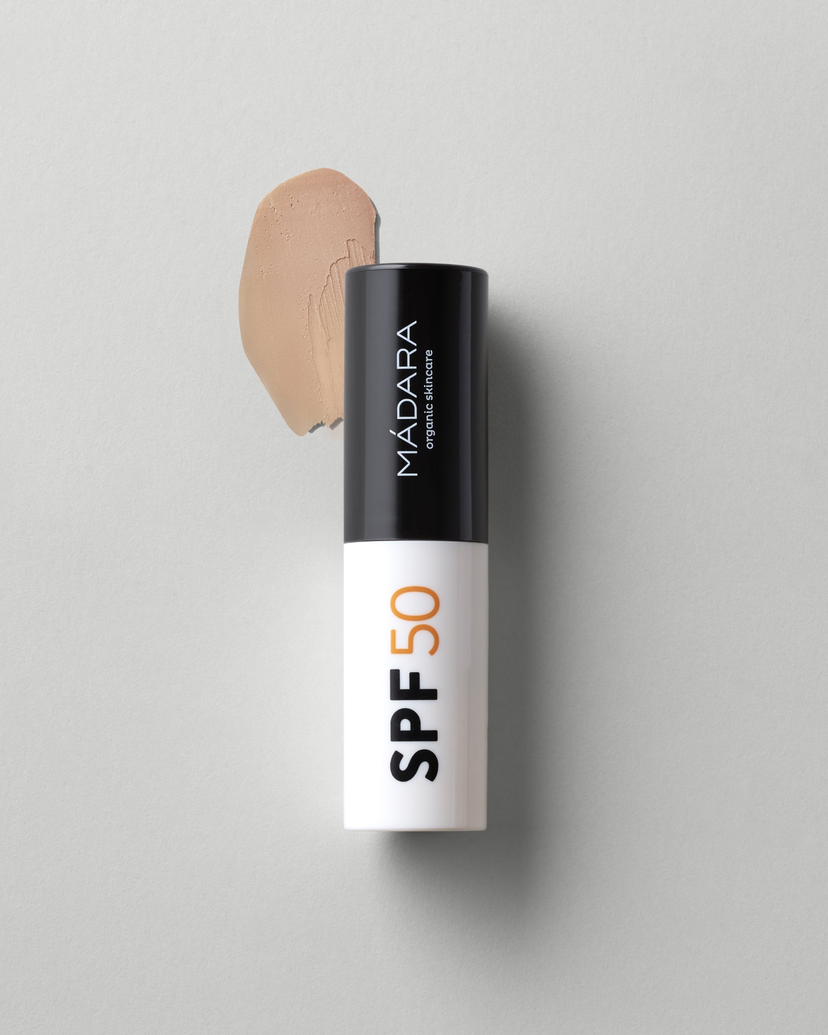 MΓDARA Organic Skincare mineral spf50 sunscreen stick A3433 mineral sunscreen product photo on plain background.