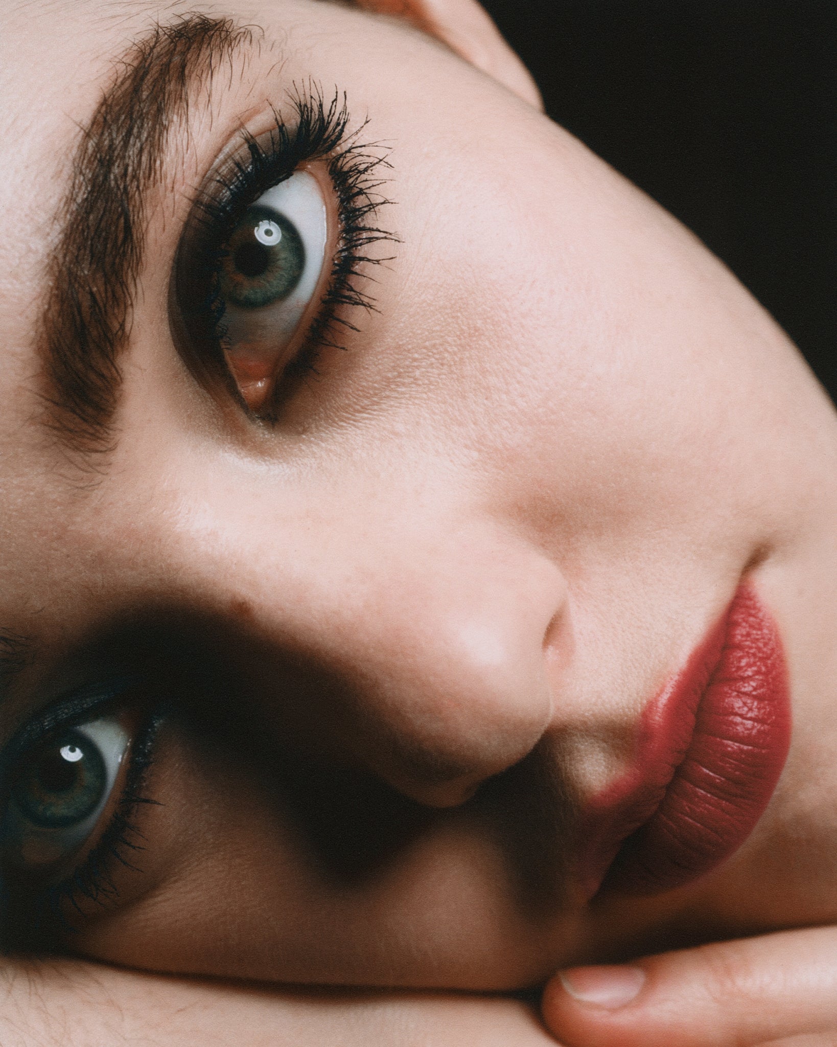 Model wearing MΓDARA Organic Skincare black eye pencil on A6881 eye contour care on skin; close-up portrait shows natural application results.